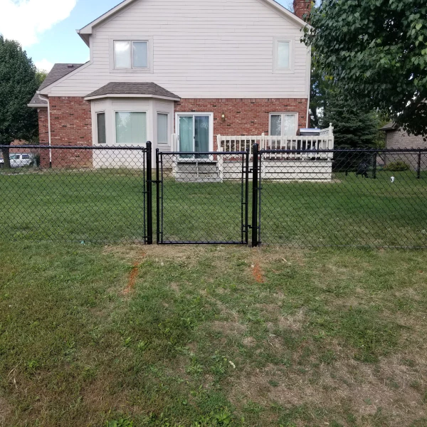 metal fence with gate installed beside a house Indianapolis IN